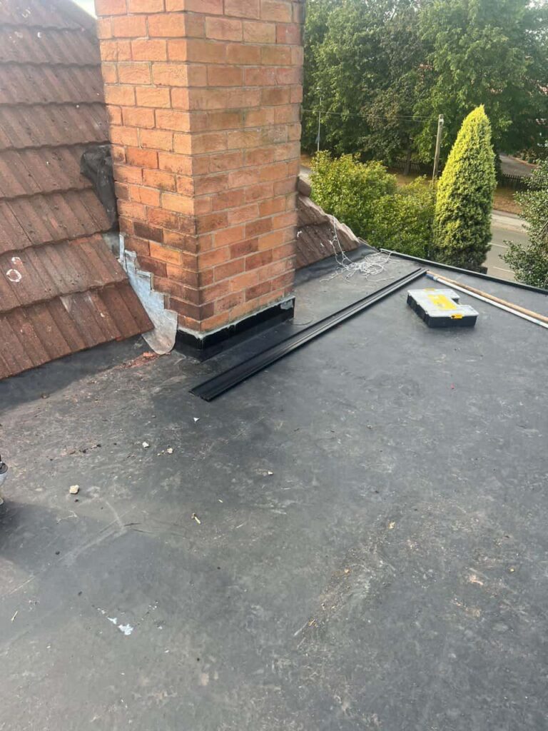This is a photo of a flat roof which has just been repaired, there is also a chimney stack and some leadwork has also been dressed. Works carried out by Bilsthorpe Roofing Repairs
